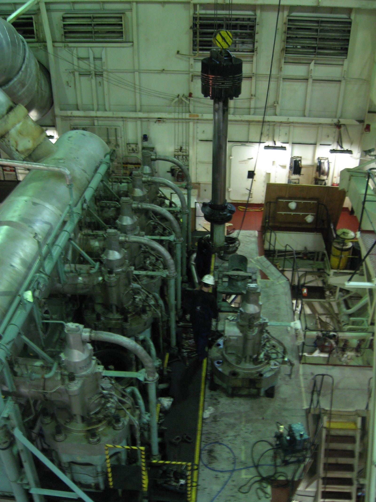Wartsila Sulzer, an old piston being removed from the main engine — M.T. Altair Voyager